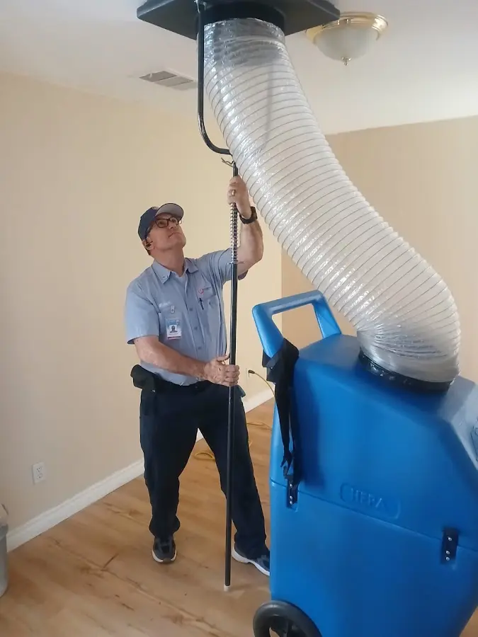 Furnace Tune-Up technician using HEPA equipment in Snoqualmie